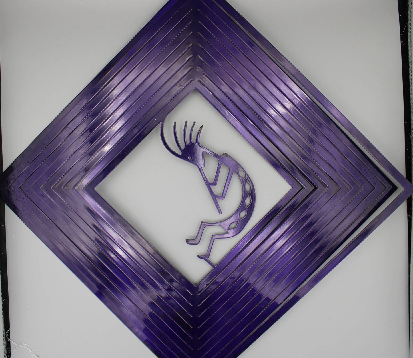 Purple Square Wind Spinner featuring a Kokopelli Figure